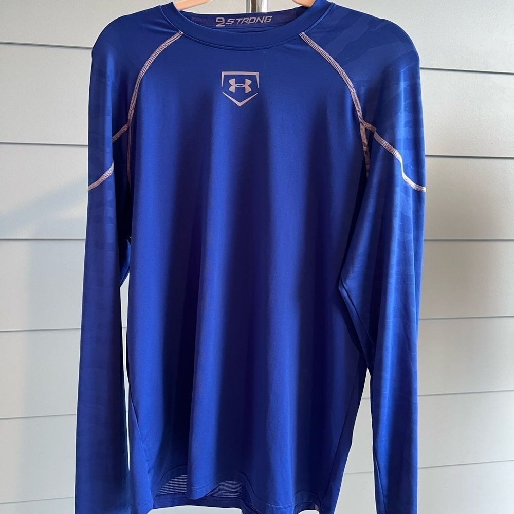 Under Armour royal blue second skin athletic layer shirt.